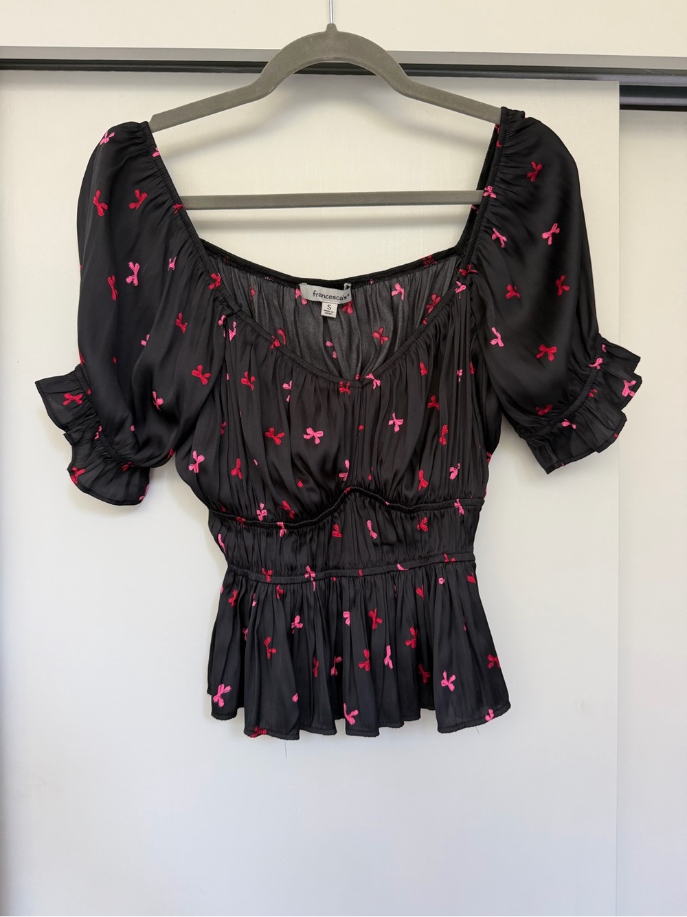 Francesca's Black Puff Sleeve Peplum Top with Pink and Red Bow Print